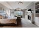 Luxurious main bedroom featuring high ceilings, a fireplace, and serene window views at 2521 Juniper Ct, Golden, CO 80401