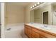 Bright bathroom with double sinks, a soaking tub, and ample counter space at 12613 Knox Pt, Broomfield, CO 80020