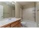 Bright bathroom featuring a shower-tub combo, large mirror, single sink vanity, and tiled flooring at 12613 Knox Pt, Broomfield, CO 80020