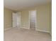 Neutral bedroom featuring a closet with shelving and an open doorway to another room at 12613 Knox Pt, Broomfield, CO 80020