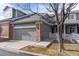 Charming townhome featuring an attached garage and welcoming front entrance at 12613 Knox Pt, Broomfield, CO 80020