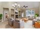 Cozy living room features a fireplace, neutral tones, and natural light at 12613 Knox Pt, Broomfield, CO 80020