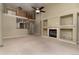 Expansive living room featuring a fireplace, tall ceilings, and neutral tones at 12613 Knox Pt, Broomfield, CO 80020