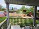 Covered outdoor patio overlooking a spacious backyard with a swing set and play area at 465 Salem St, Aurora, CO 80011
