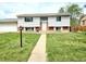 Charming two-story home with light siding, brick accents, and a well-manicured front lawn at 465 Salem St, Aurora, CO 80011