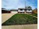 Inviting two-story home with light siding, brick details, and a spacious two car garage at 465 Salem St, Aurora, CO 80011