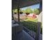 Covered porch overlooking the backyard with a greenhouse and shed at 465 Salem St, Aurora, CO 80011