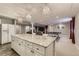 Finished basement with a kitchenette, ping pong table, and a comfortable seating area for entertaining at 6254 S Riviera Ct, Aurora, CO 80016