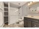 Bathroom featuring a glass enclosed shower, open shelving, and a modern vanity at 6254 S Riviera Ct, Aurora, CO 80016