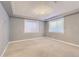 Bedroom with neutral walls, carpeted floor, two windows, and ceiling light at 6254 S Riviera Ct, Aurora, CO 80016