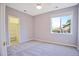 Bedroom features neutral decor, a ceiling fan and a closet room next to a bright window at 6254 S Riviera Ct, Aurora, CO 80016