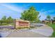 Community entrance sign for Saddle Rock Community Center with lush landscaping at 6254 S Riviera Ct, Aurora, CO 80016