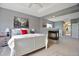 Stylish main bedroom with fireplace feature, neutral colors, and attached bathroom at 6254 S Riviera Ct, Aurora, CO 80016