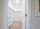 Spacious walk-in closet with custom shelving and ample storage space for clothing and accessories at 6254 S Riviera Ct, Aurora, CO 80016