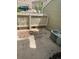 Backyard with concrete patio, white fence, and AC Unit at 14096 E Radcliff Cir, Aurora, CO 80015