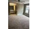 Bedroom with carpet flooring and a view of the bathroom and natural light coming in at 14096 E Radcliff Cir, Aurora, CO 80015