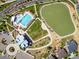 Aerial view of a community pool and adjacent green space, creating a welcoming and vibrant atmosphere at 1125 Anker Dr, Erie, CO 80516