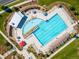 Aerial view of a resort-style community pool with ample lounge seating and meticulously landscaped surroundings at 1125 Anker Dr, Erie, CO 80516