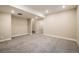 Finished basement featuring new carpet and recessed lighting at 1125 Anker Dr, Erie, CO 80516