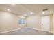 Spacious carpeted basement with recessed lighting and large window at 1125 Anker Dr, Erie, CO 80516