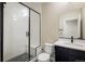 Modern bathroom with glass-enclosed shower and granite vanity at 1125 Anker Dr, Erie, CO 80516