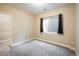 Cozy bedroom featuring new carpet, window and closet space at 1125 Anker Dr, Erie, CO 80516