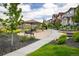 Community park area with covered picnic tables, seating, and lush landscaping at 1125 Anker Dr, Erie, CO 80516