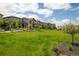 Beautiful townhome community featuring lush landscaping and walking paths at 1125 Anker Dr, Erie, CO 80516
