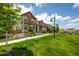 Street view of homes in a neighborhood with manicured lawns and landscaping at 1125 Anker Dr, Erie, CO 80516