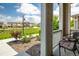 Cozy front porch with patio furniture and a view of the grassy common area at 1125 Anker Dr, Erie, CO 80516