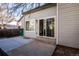 Home exterior featuring a sliding glass door and a concrete patio at 2217 S Nome Ct, Aurora, CO 80014