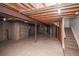 Unfinished basement with exposed ceiling and concrete walls at 2217 S Nome Ct, Aurora, CO 80014