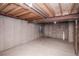 Unfinished basement with exposed ceiling and concrete walls at 2217 S Nome Ct, Aurora, CO 80014