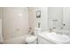 Bright bathroom with bathtub, toilet, and vanity with a clean white design at 2217 S Nome Ct, Aurora, CO 80014