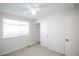 Cozy bedroom features a ceiling fan, window with blinds, closet, and neutral carpet at 2217 S Nome Ct, Aurora, CO 80014