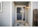 Inviting front entrance with a stylish door, sidelight, and 'welcome' mat at 2217 S Nome Ct, Aurora, CO 80014