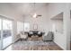 Living room with vaulted ceiling, large window, and an open concept layout at 2217 S Nome Ct, Aurora, CO 80014