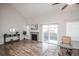 Bright living room with fireplace, sliding door to backyard, and stylish decor at 2217 S Nome Ct, Aurora, CO 80014