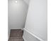 Carpeted stairs with white railings lead to the upper level at 2217 S Nome Ct, Aurora, CO 80014