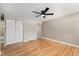 Spacious bedroom featuring hardwood floors, a ceiling fan and a closet at 1150 Rosemary St, Denver, CO 80220
