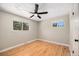 Bedroom with hardwood floors, a ceiling fan, neutral walls and natural light at 1150 Rosemary St, Denver, CO 80220