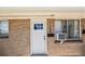 Close-up of the front entry highlighting the house number and brick facade at 1150 Rosemary St, Denver, CO 80220