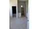 Bathroom with tile floor, dual vanities, and walk-in closet access at 5841 Powell Rd, Parker, CO 80134