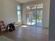 Bright dining room with hardwood floors and access to the outdoor deck at 5841 Powell Rd, Parker, CO 80134