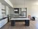 Modern kitchen with two islands, custom cabinets, and stainless steel appliances at 5841 Powell Rd, Parker, CO 80134
