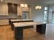Bright, modern kitchen with two large islands, stainless steel appliances, and plenty of counter space at 5841 Powell Rd, Parker, CO 80134
