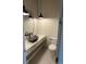 Modern powder room with unique sink and stylish fixtures at 5841 Powell Rd, Parker, CO 80134