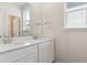 Bathroom featuring double sinks with white countertops and modern fixtures at 14125 Deertrack Ln, Parker, CO 80134