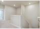 Bright hallway with neutral carpeting and staircase leading to the upper level at 14125 Deertrack Ln, Parker, CO 80134