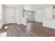 Open-concept living area features lots of light, wood flooring, and adjacent kitchen at 14125 Deertrack Ln, Parker, CO 80134